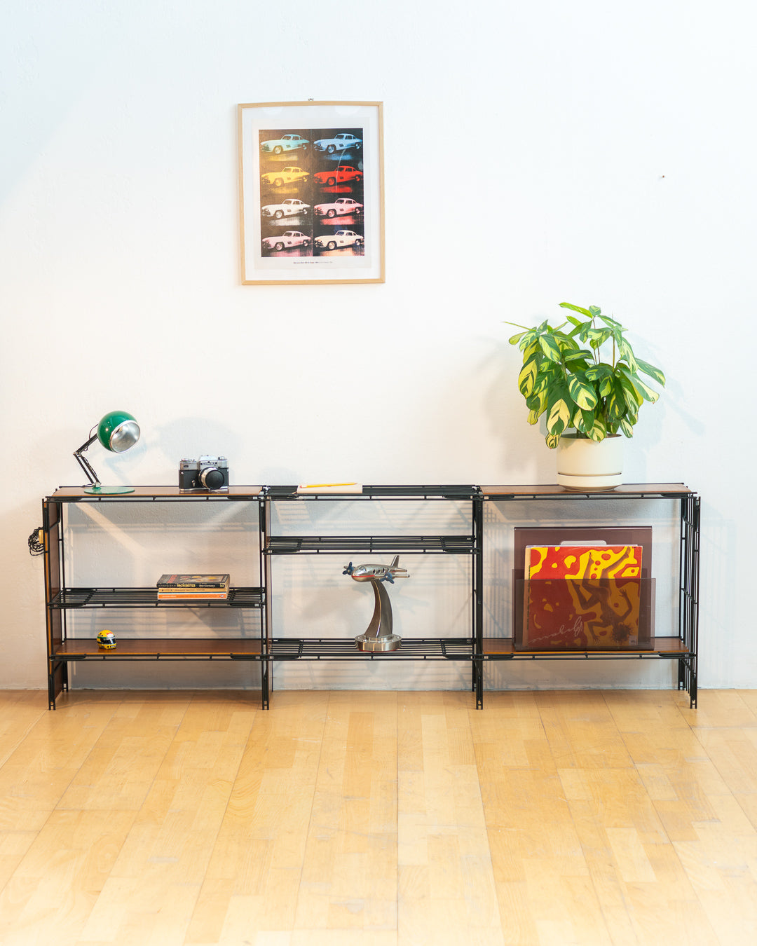 Vintage 1960s teak wood and matte black Multistrux modular string shelving system with twelve shelves, restored vintage design piece. Vecino Shop