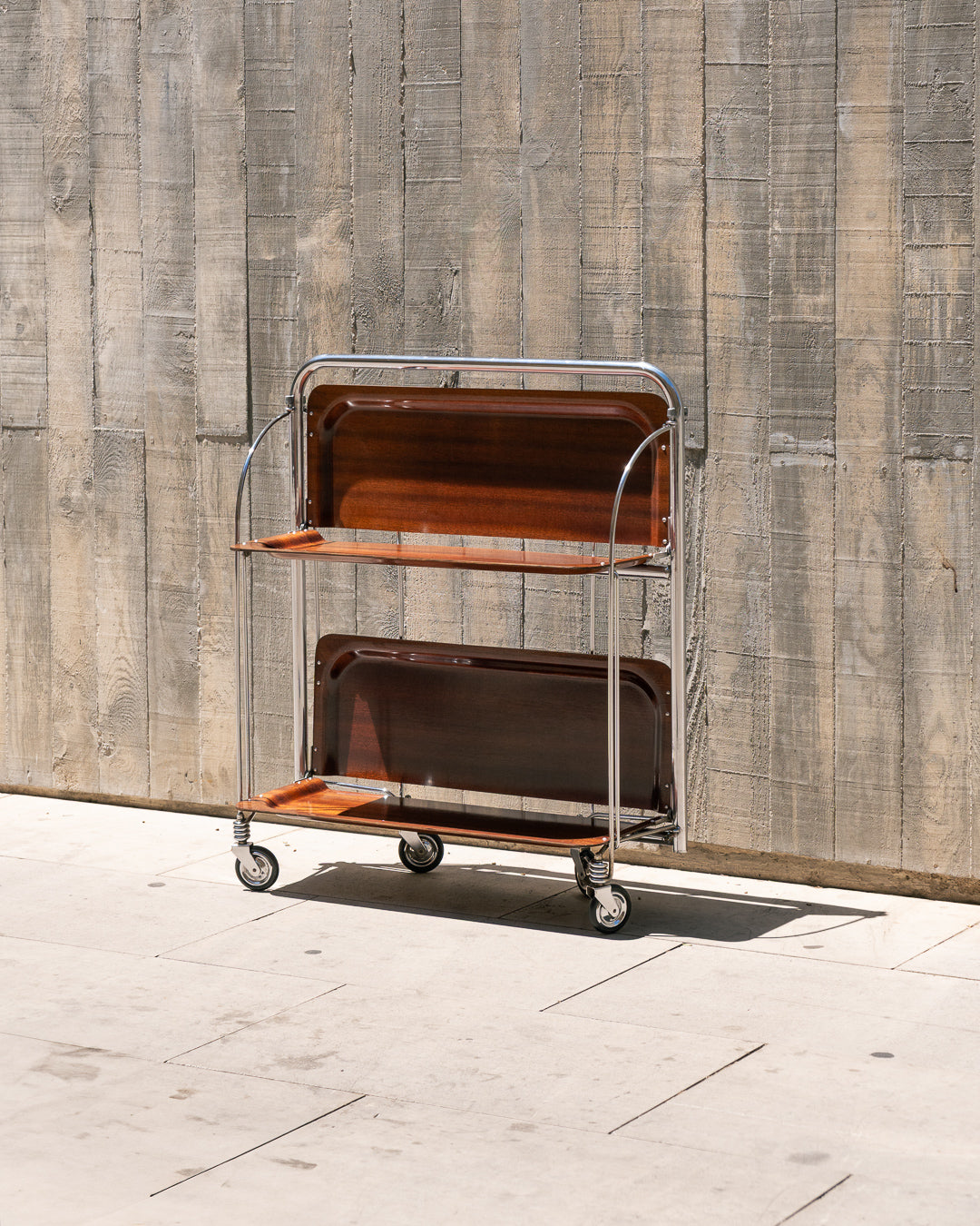 Raquer vintage folding bar cart from the 1960s in dark wood finish with lacquered metal frame and wheels – Vecino Shop