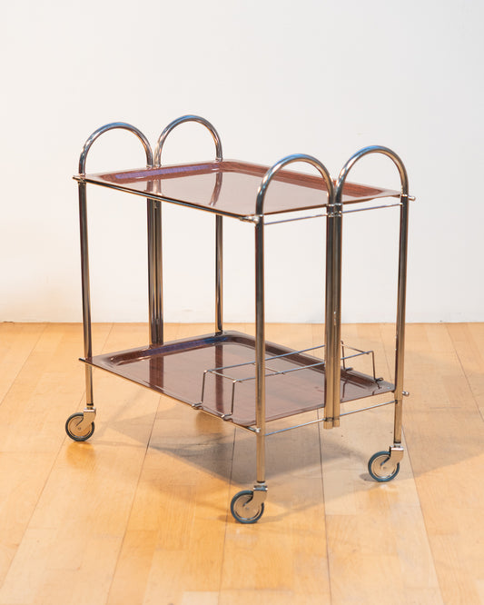 Vintage 1960s Arch folding serving trolley with chrome frame and wood veneer trays, Mid-Century modern bar cart with integrated drink holder accessory, compact foldable design – Vecino Shop