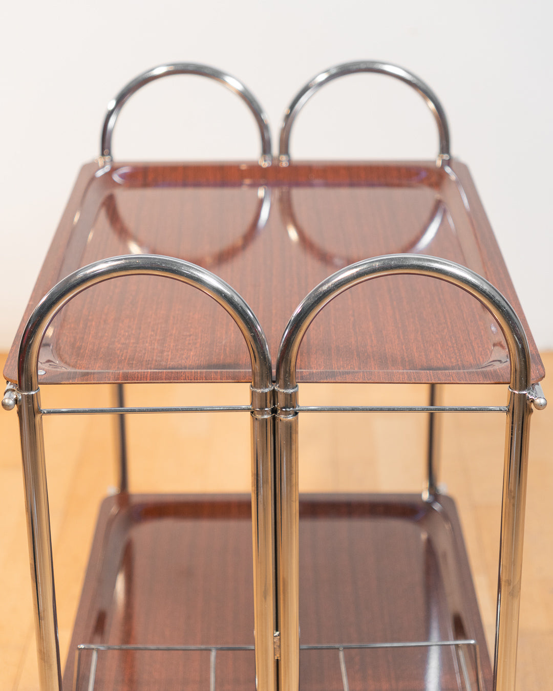Vintage 1960s Arch folding serving trolley with chrome frame and wood veneer trays, Mid-Century modern bar cart with integrated drink holder accessory, compact foldable design – Vecino Shop
