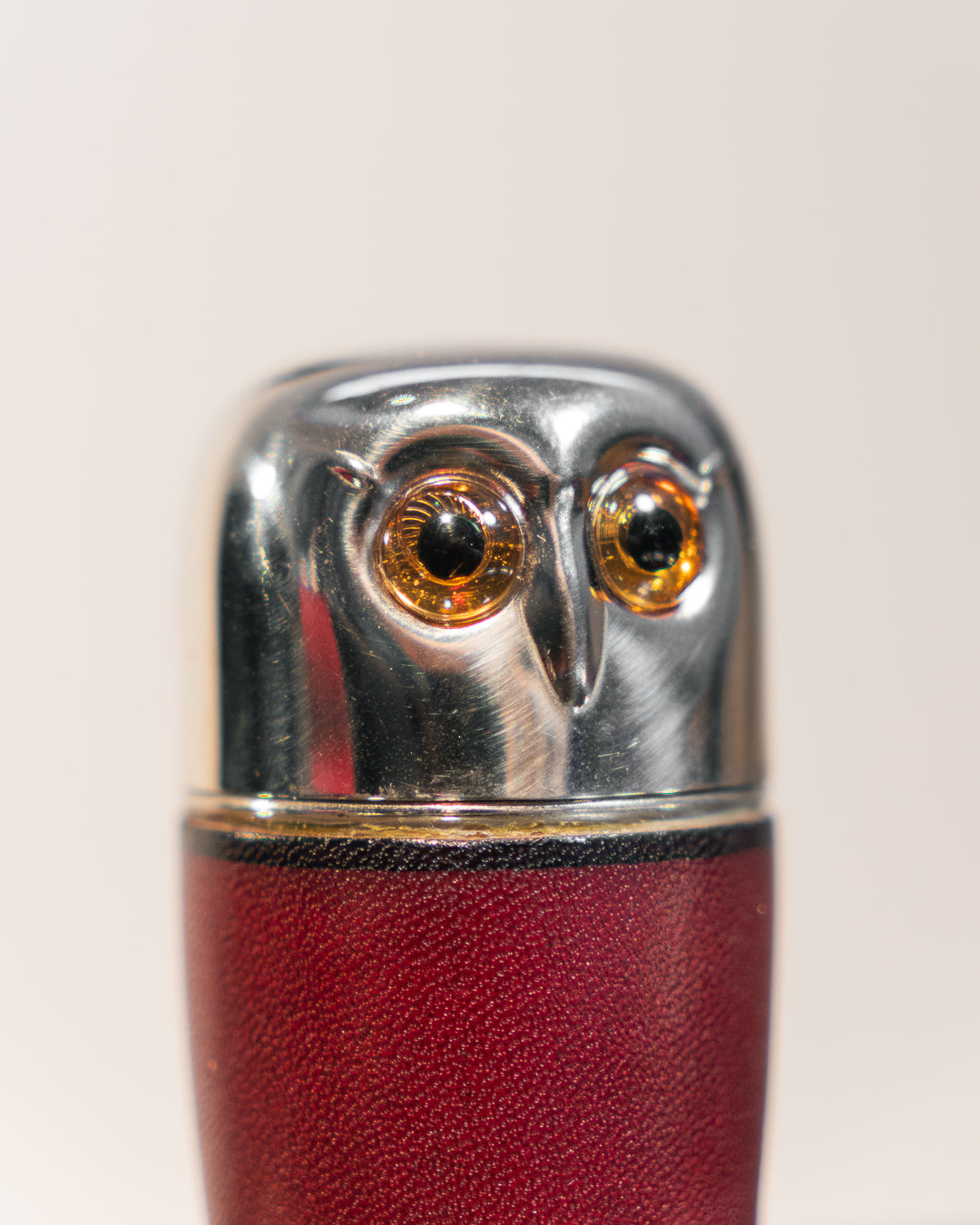 Vintage owl nesting shot glass set from West Germany with chrome head, amber eyes, and leather body. Vecino Shop