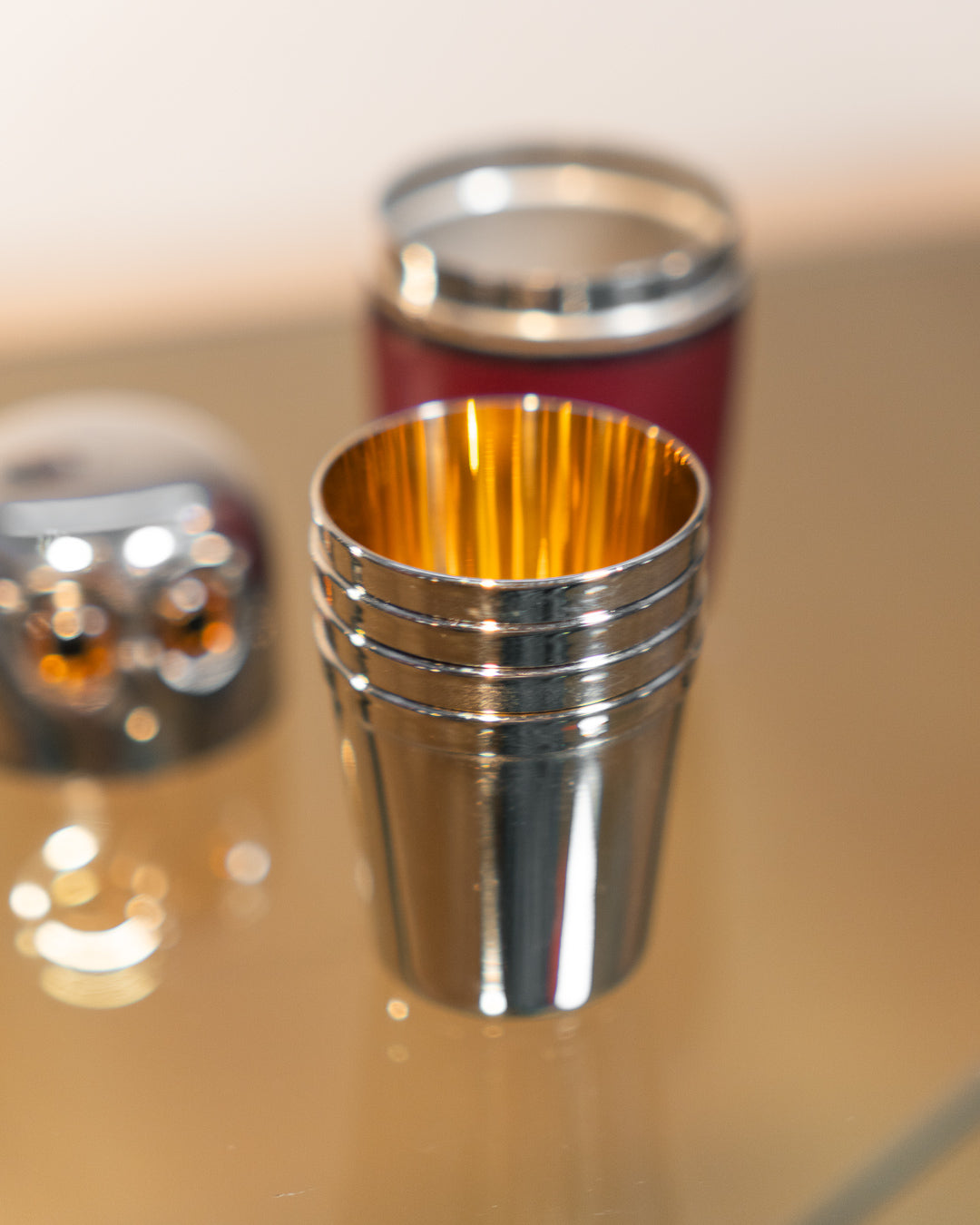 Vintage owl nesting shot glass set from West Germany with chrome head, amber eyes, and leather body. Vecino Shop