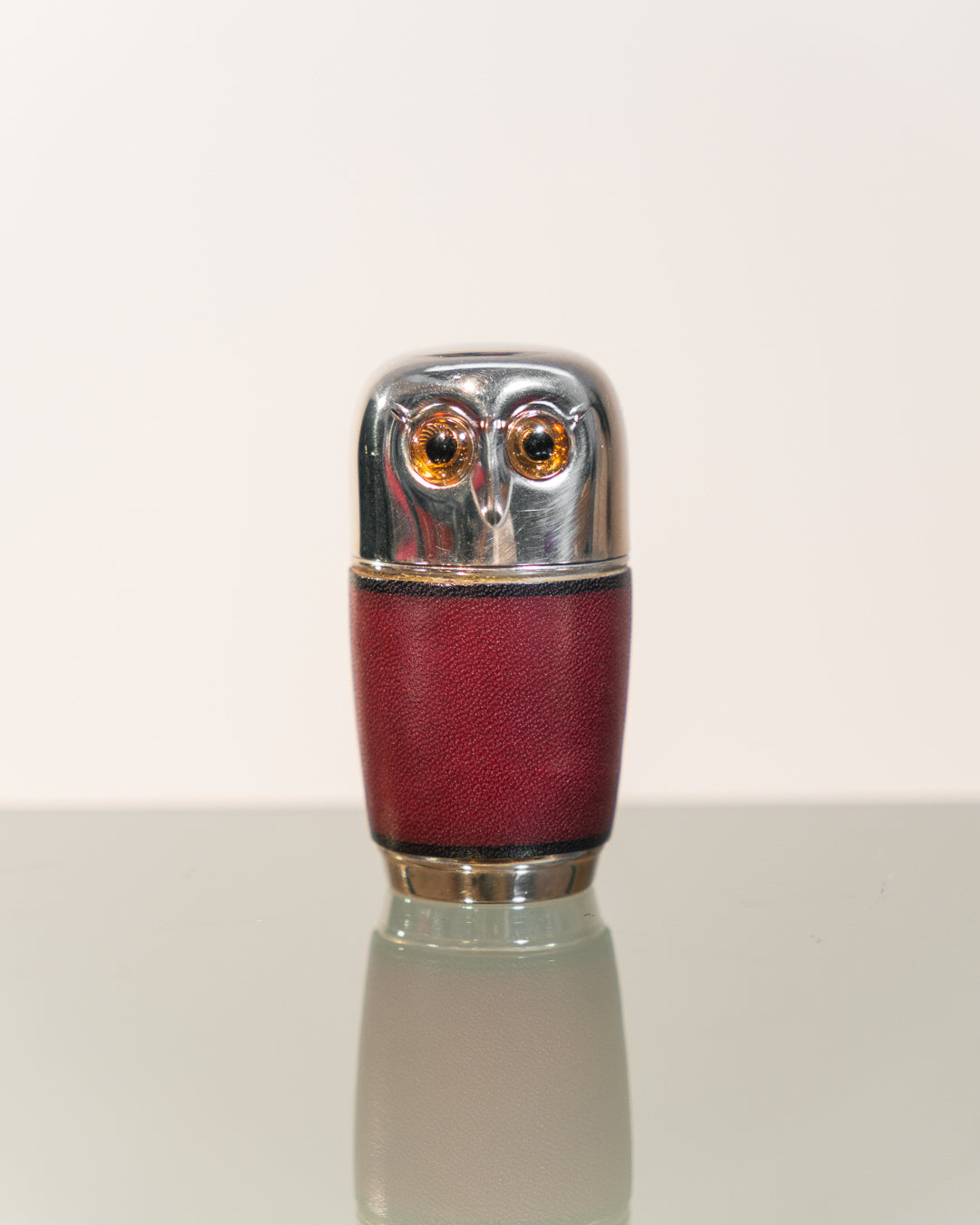 Vintage owl nesting shot glass set from West Germany with chrome head, amber eyes, and leather body. Vecino Shop