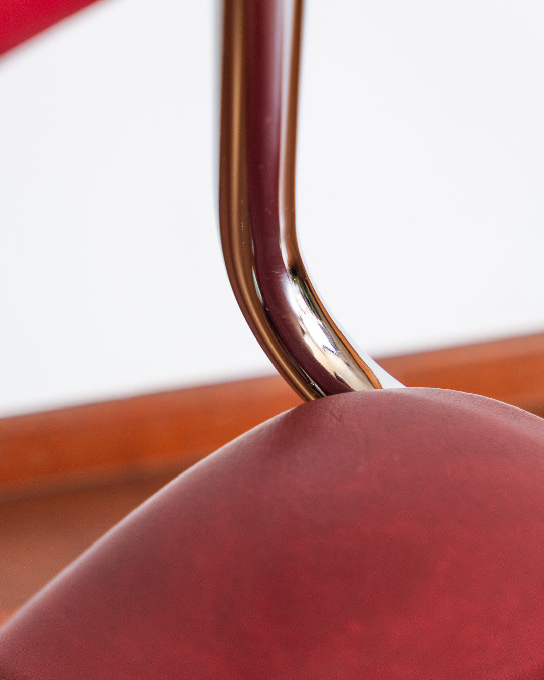Mid-century chrome cantilever chair with red vinyl upholstery