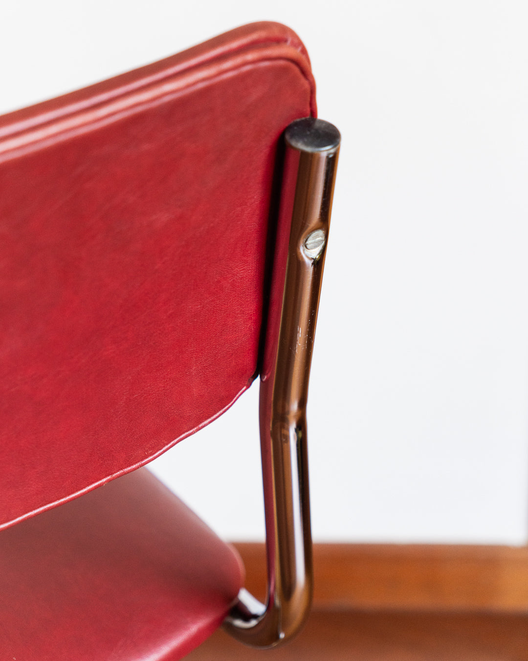 Mid-century chrome cantilever chair with red vinyl upholstery