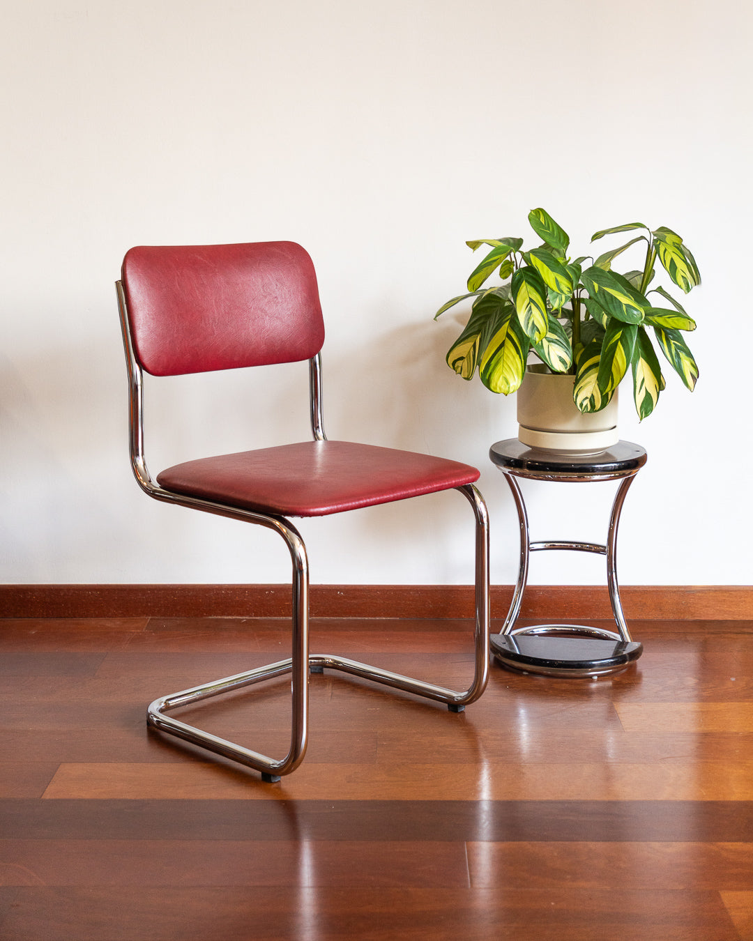Mid-century chrome cantilever chair with red vinyl upholstery