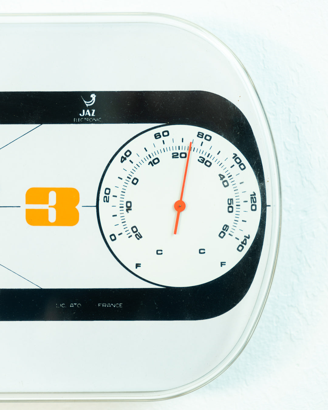 Vintage Jaz Electronic Thermic wall clock in white and orange with thermometer, 1975 French Space Age design. Vecino Shop