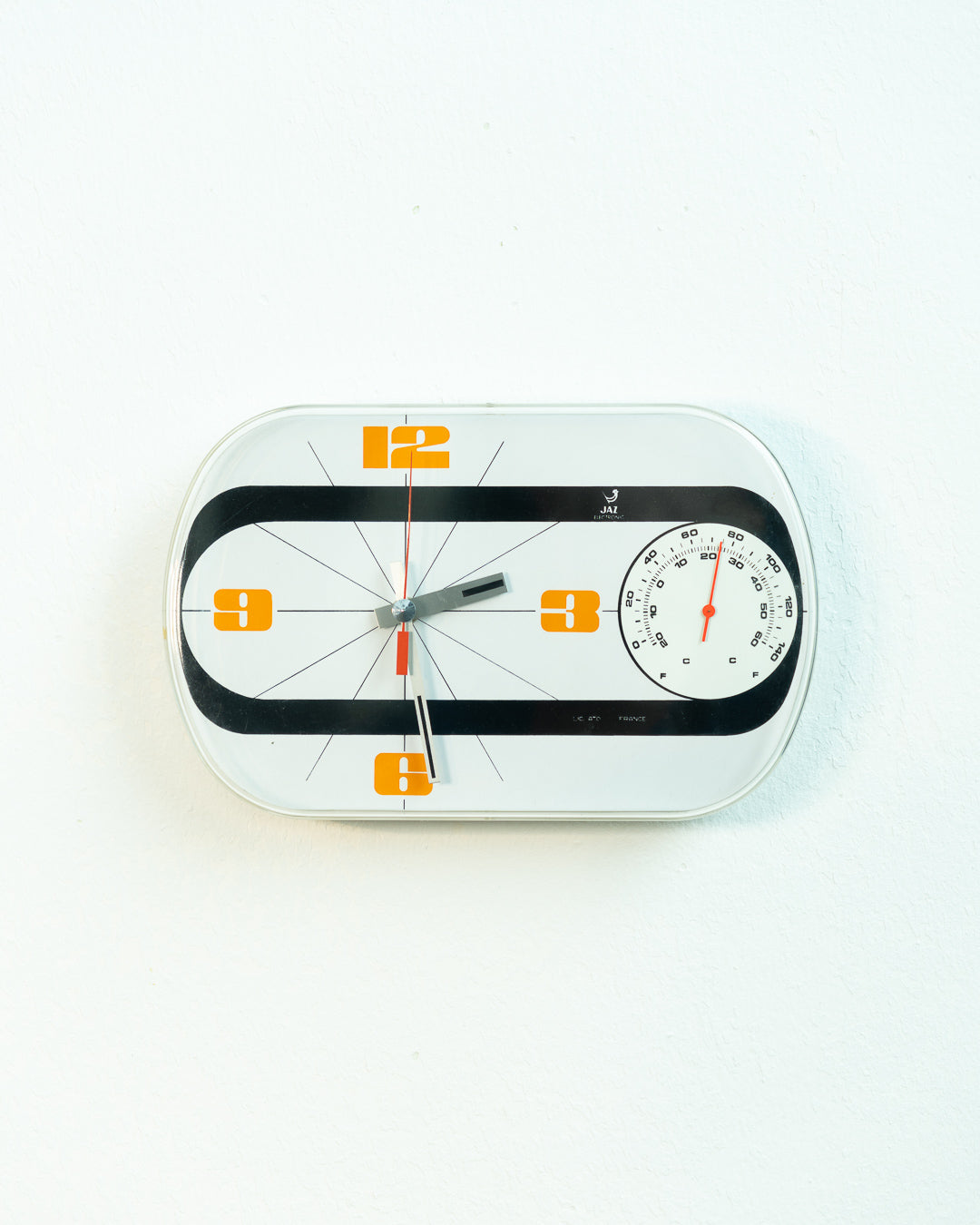 Vintage Jaz Electronic Thermic wall clock in white and orange with thermometer, 1975 French Space Age design. Vecino Shop