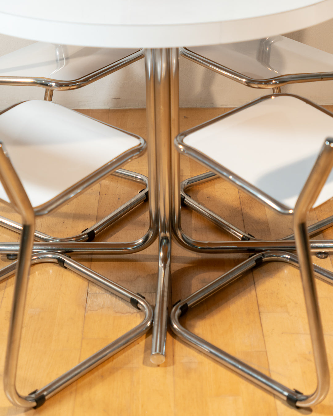 Vintage 1970s Bauhaus dining set with white formica cantilever chairs and chrome pedestal dining table - Mid Century Modern. Vecino Shop