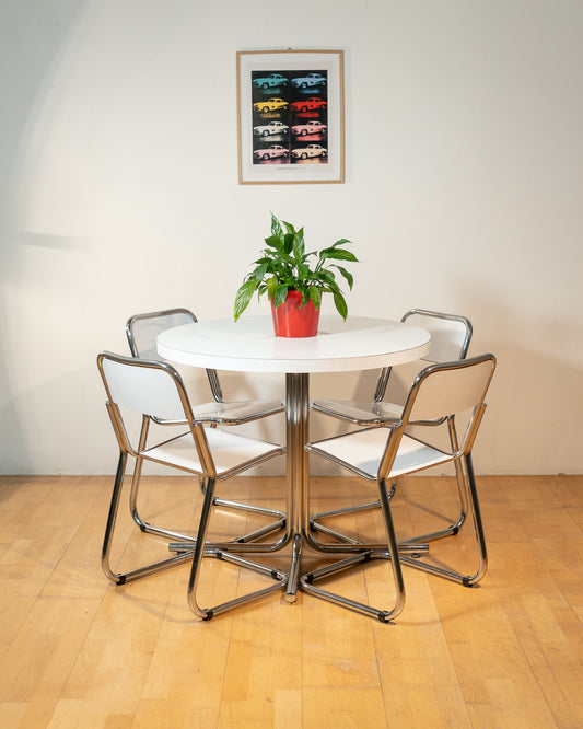 Vintage 1970s Bauhaus dining set with white formica cantilever chairs and chrome pedestal dining table - Mid Century Modern. Vecino Shop