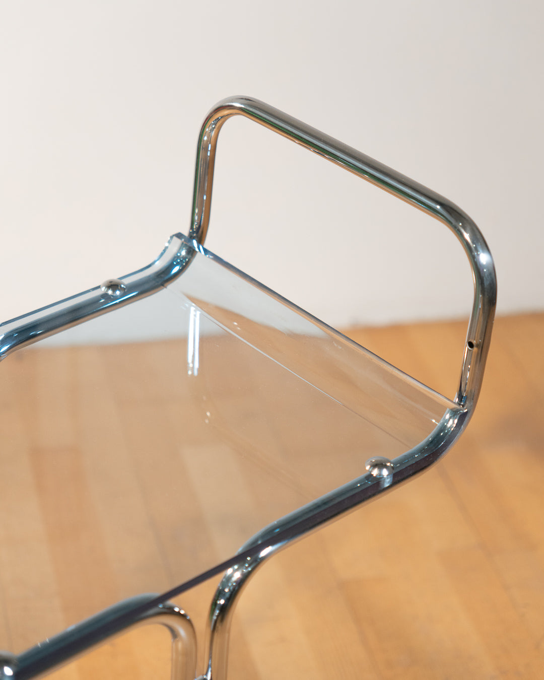 1970s chrome rolling side table with baby blue acrylic shelves, two-level mid-century modern design. Vecino Shop