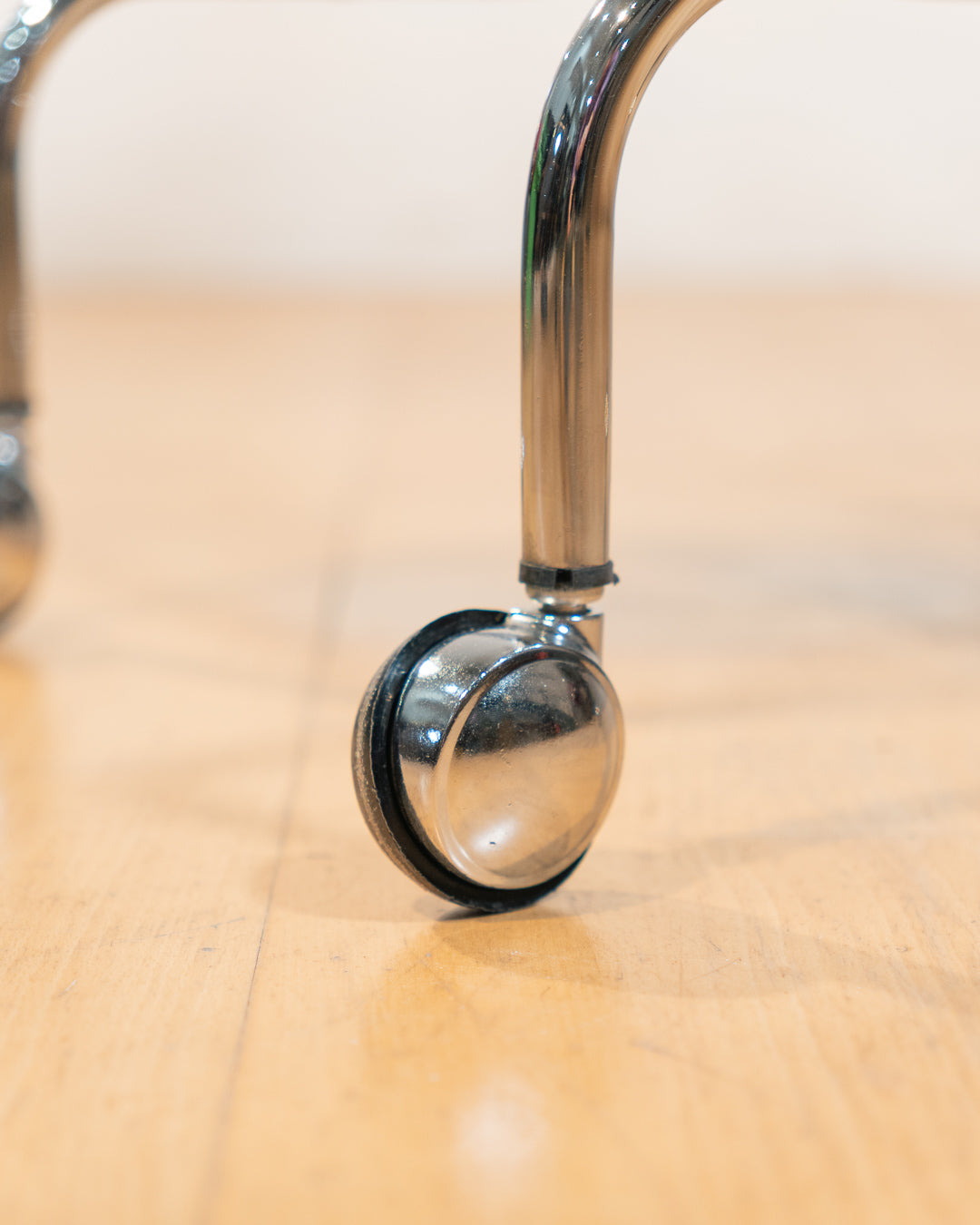 1970s chrome rolling side table with baby blue acrylic shelves, two-level mid-century modern design. Vecino Shop