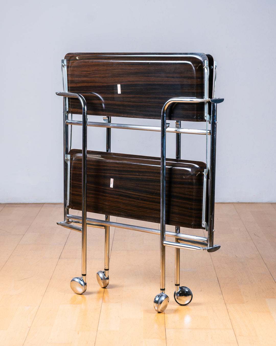 Vintage 1960s dark woodgrain folding trolley with  Formica shelves and chrome details. Made in France. Space Age Bar Cart, drinks trolley. Mid Century Modern. Vecino Shop