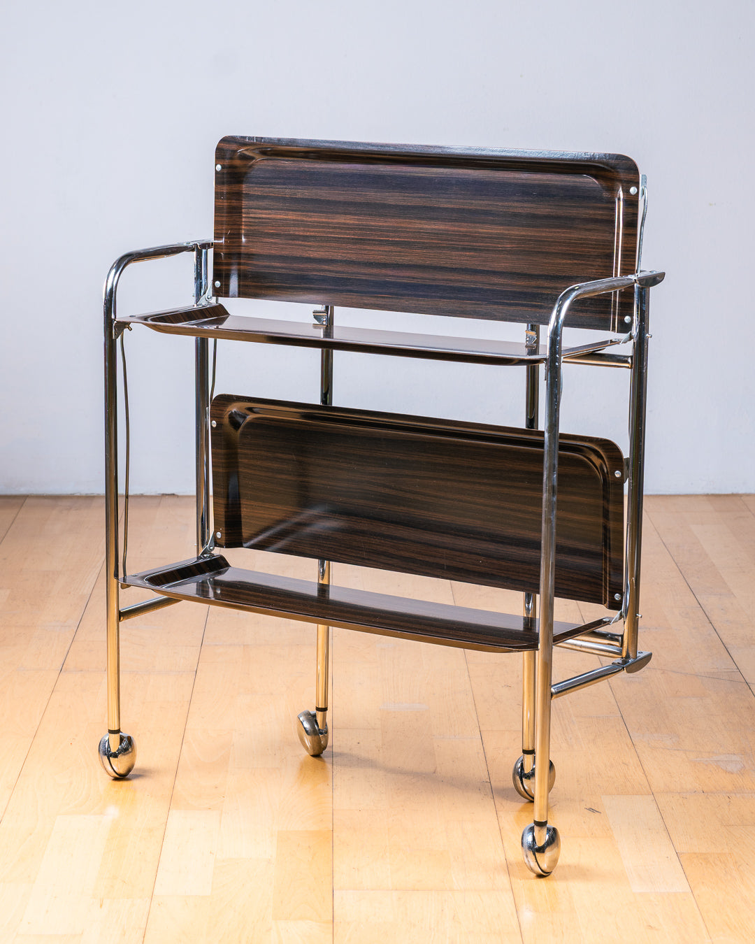 Vintage 1960s dark woodgrain folding trolley with  Formica shelves and chrome details. Made in France. Space Age Bar Cart, drinks trolley. Mid Century Modern. Vecino Shop