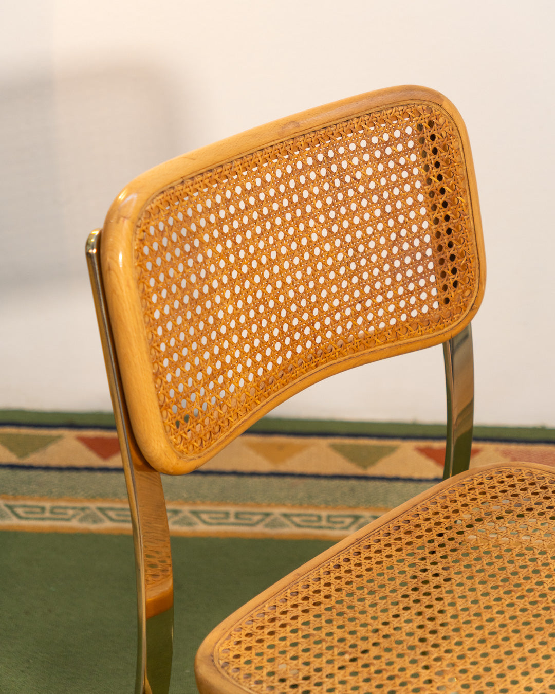 Rare 1970s vintage chair with golden metal frame, wooden seat and rattan backrest, iconic design – Vecino Shop