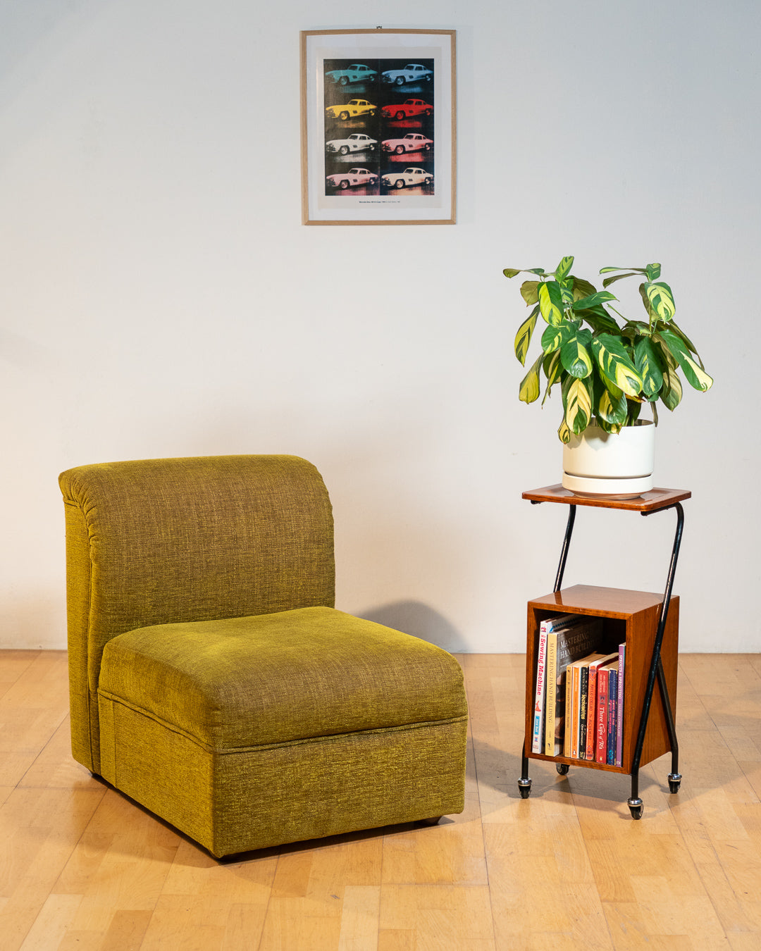 1960s mid-century rolling side table, wood veneer top, chrome frame, built-in bookcase. Vecino Shop