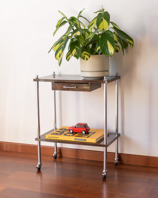 Vintage MCM 1960s chrome and wood veneer rolling table with drawer and caster wheels