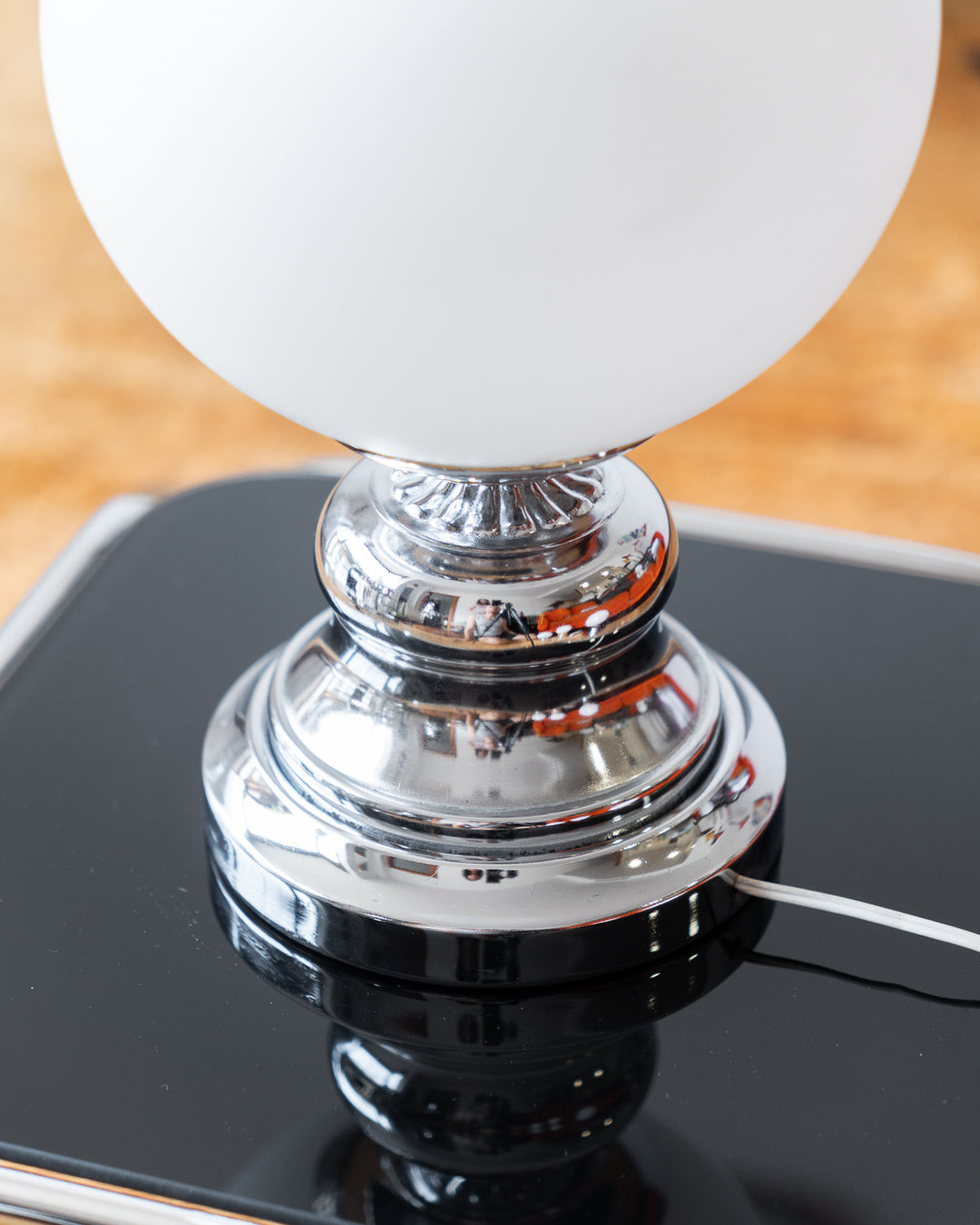 Vintage MCM Chrome Table Lamp with Opaline Globe – Art Deco Design

Striking vintage table lamp featuring a sculptural chrome base and a classic white opaline globe shade. The bold, rounded silhouette of the base brings mid-century atomic flair, while the smooth matte glow of the globe offers timeless softness. A stunning accent light for a console, bedside table, or reading nook
