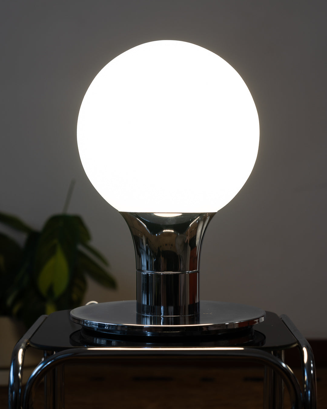 Vintage Space Age table lamp with sculptural chrome base and white opaline glass globe – Vecino Shop