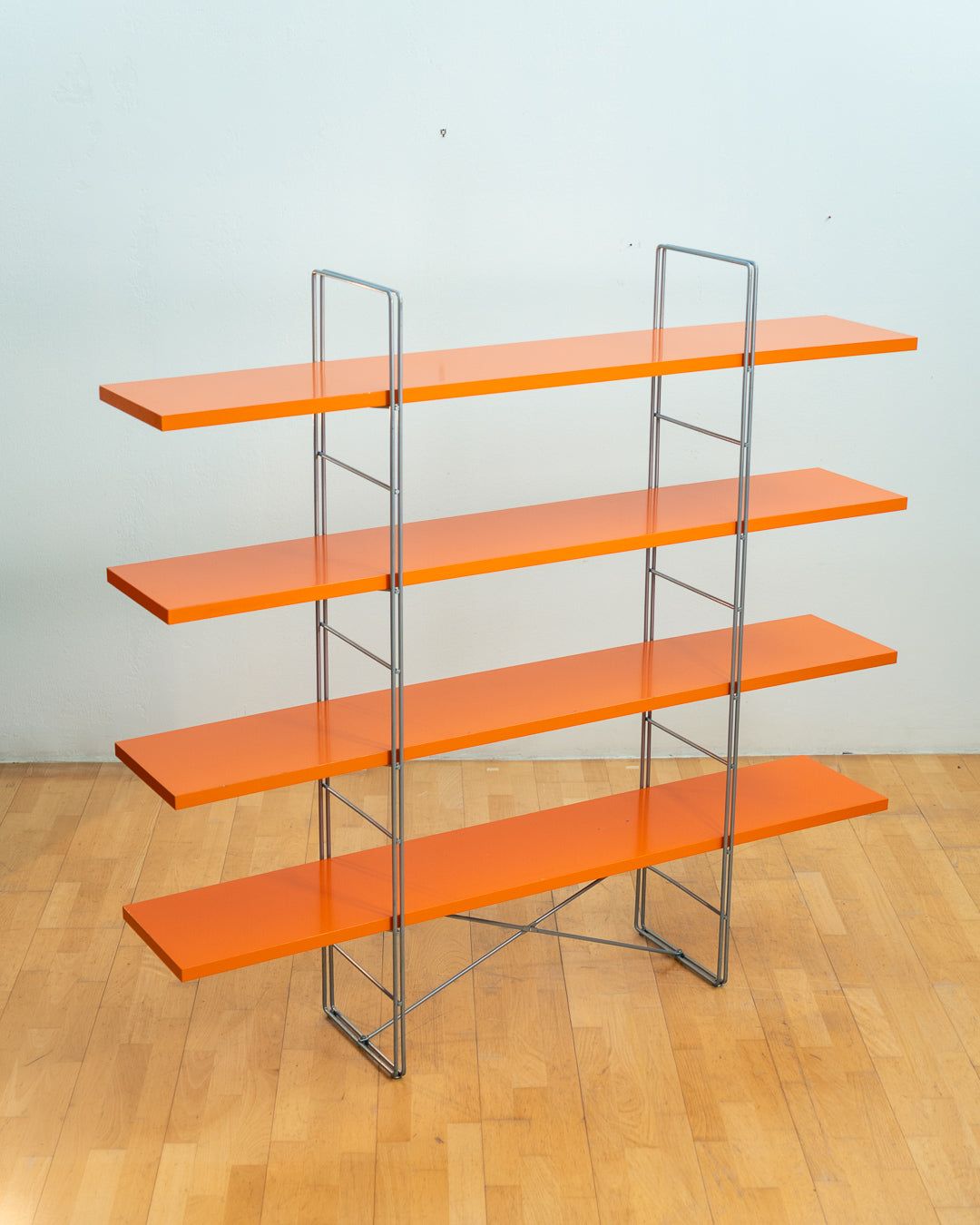 Vintage IKEA ENETRI shelving unit in rare orange finish with four shelves and silver metal wire frame from the 1990s. Vecino Shop
