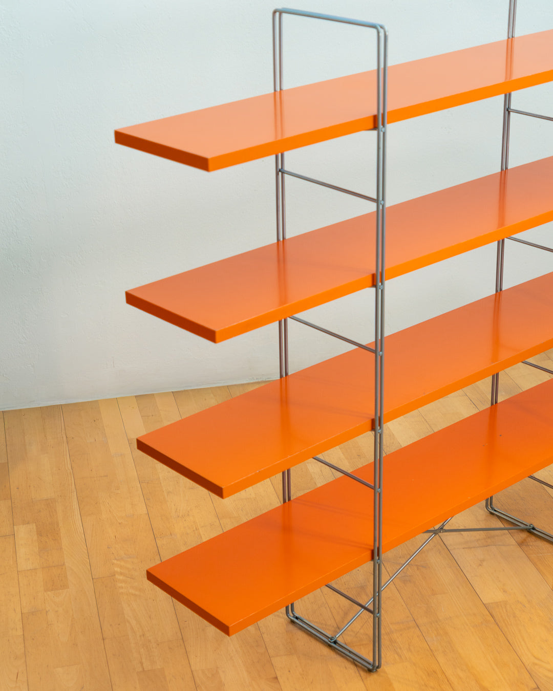 Vintage IKEA ENETRI shelving unit in rare orange finish with four shelves and silver metal wire frame from the 1990s. Vecino Shop