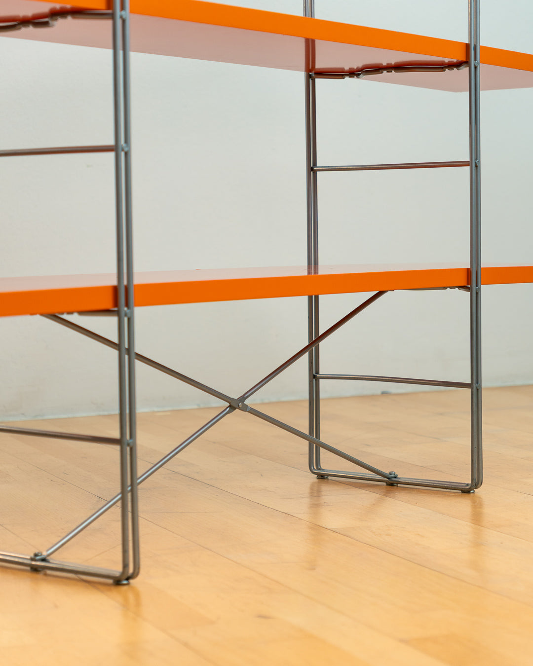 Vintage IKEA ENETRI shelving unit in rare orange finish with four shelves and silver metal wire frame from the 1990s. Vecino Shop