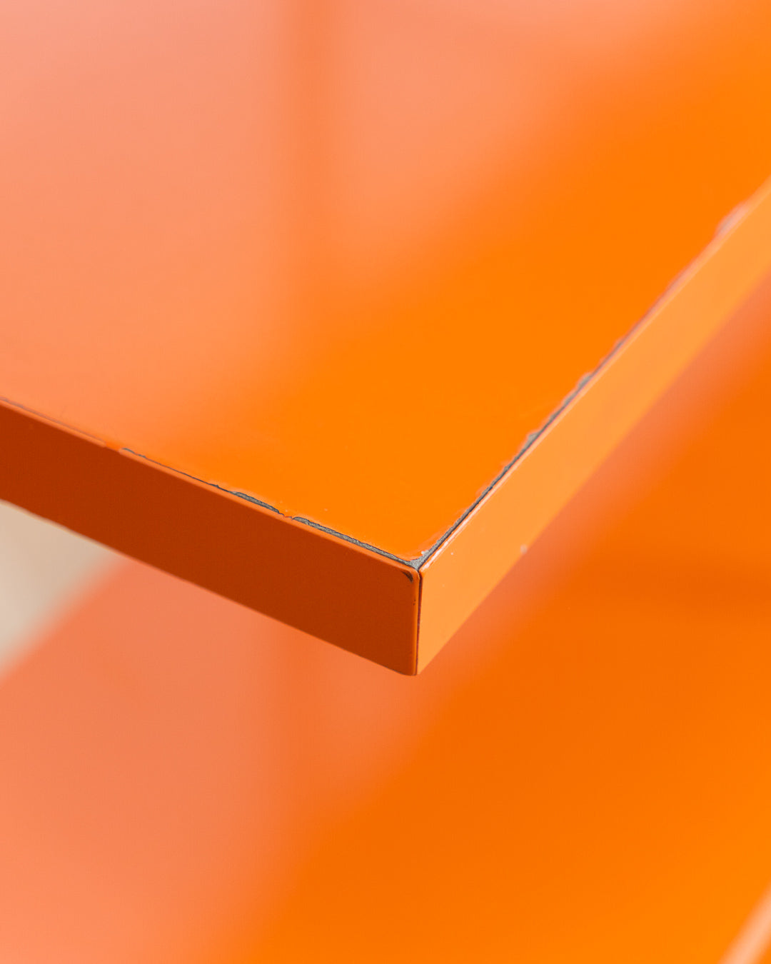 Vintage IKEA ENETRI shelving unit in rare orange finish with four shelves and silver metal wire frame from the 1990s. Vecino Shop