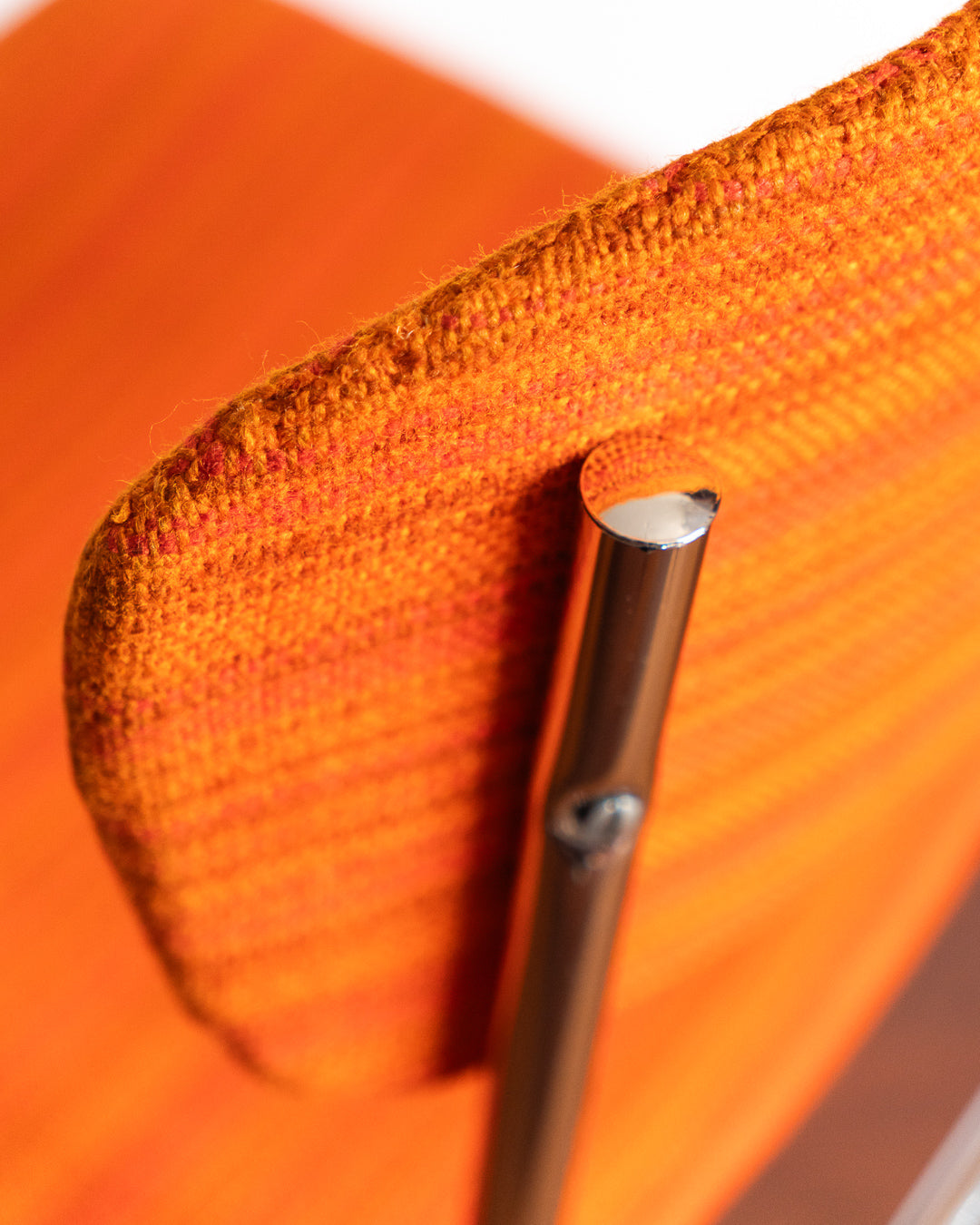 Pair of 1960s Space Age chrome chairs with orange striped fabric upholstery.