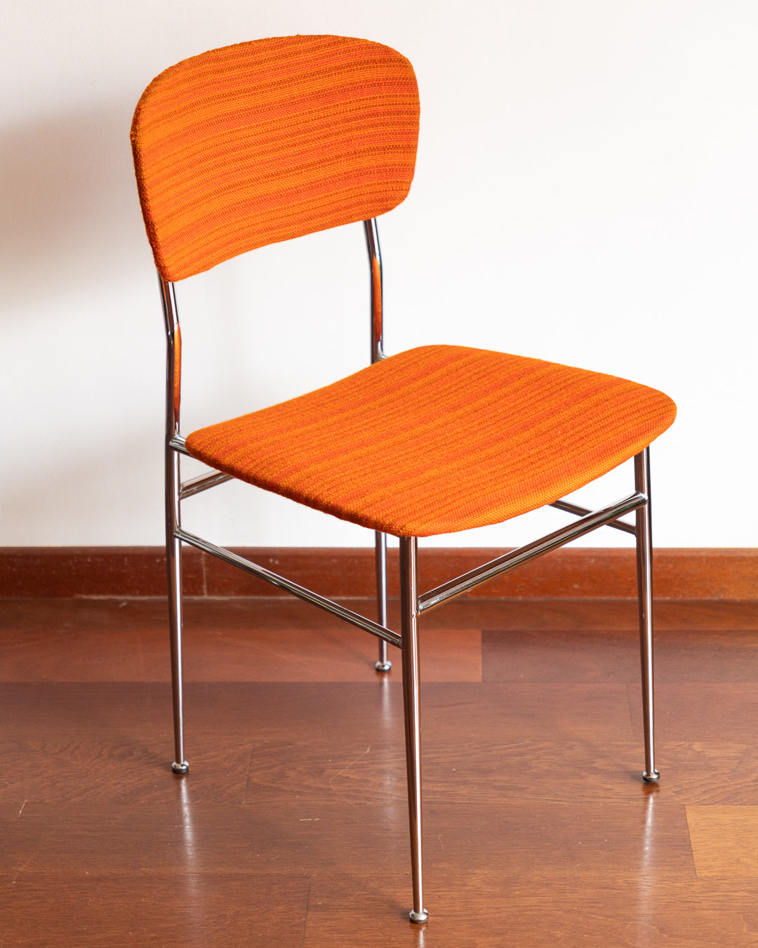 Pair of 1960s Space Age chrome chairs with orange striped fabric upholstery.