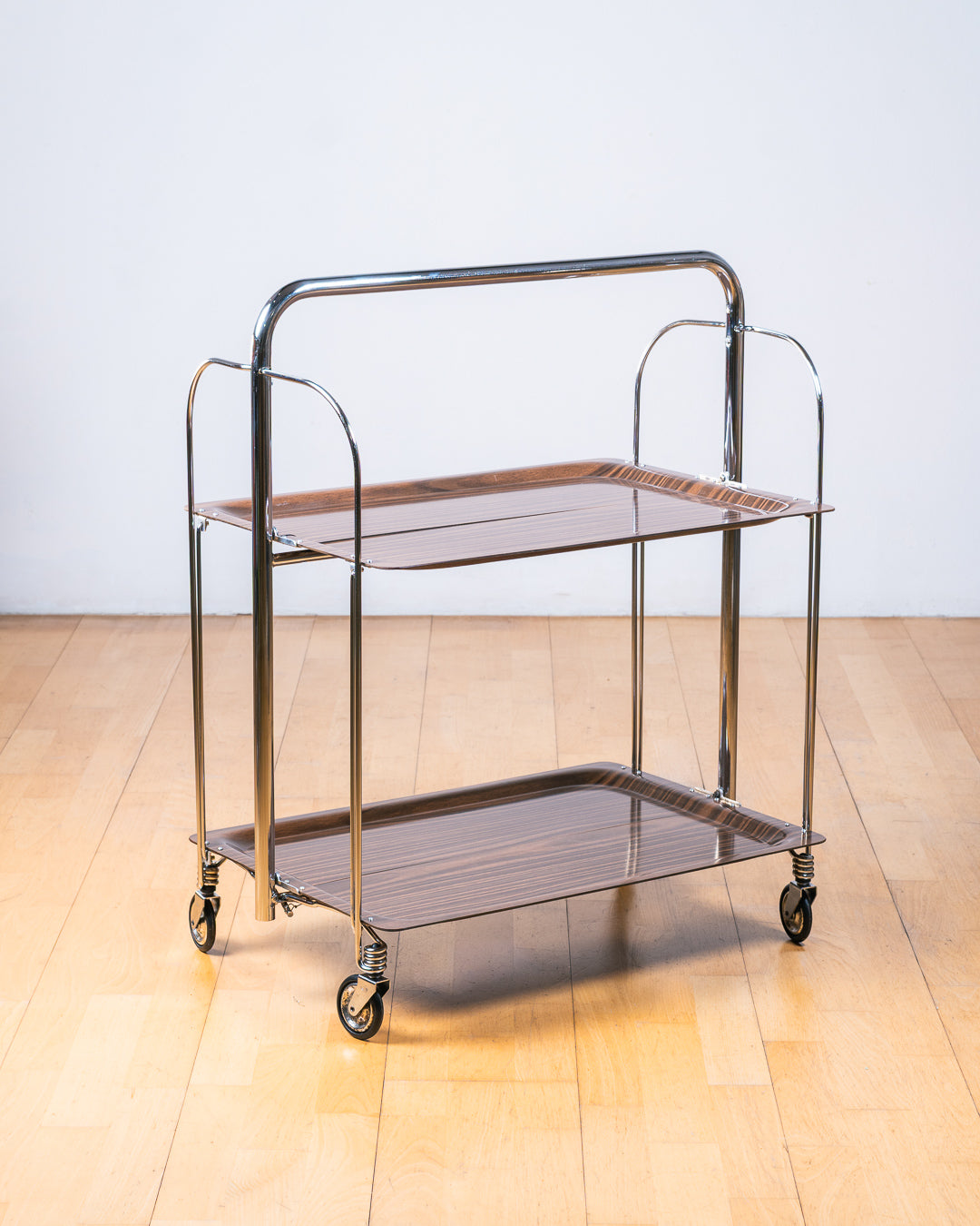 Vintage 1960s Raquer dark woodgrain folding trolley with  Formica shelves and chrome details. Bar Cart, drinks trolley. Mid Century Modern. Vecino Shop