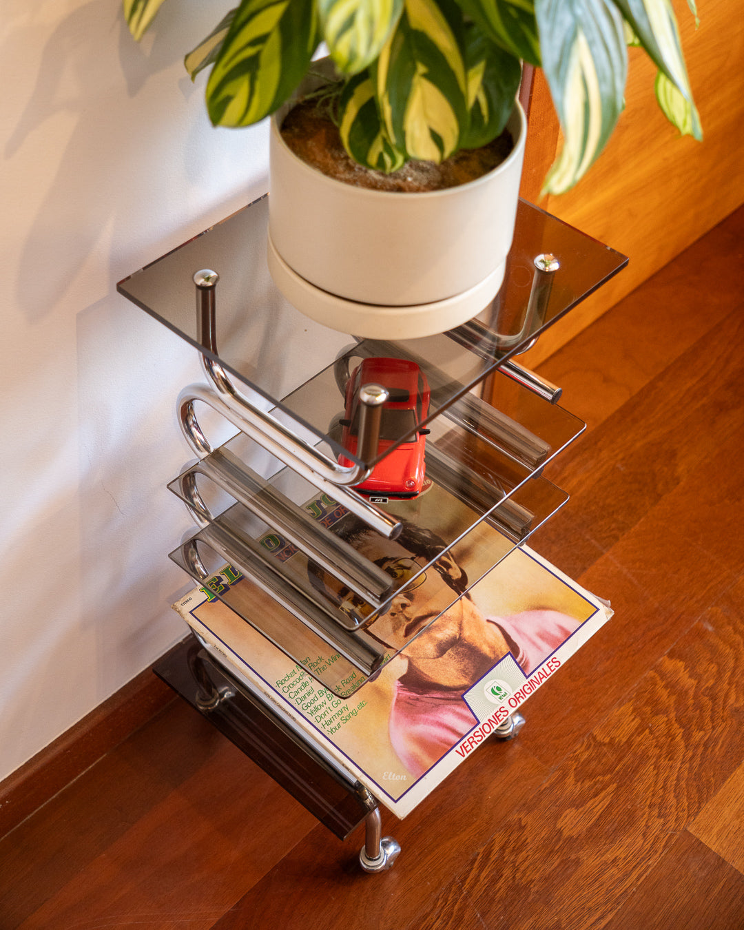 Chrome side table with acrylic and smoked glass shelves, 1970s vintage.