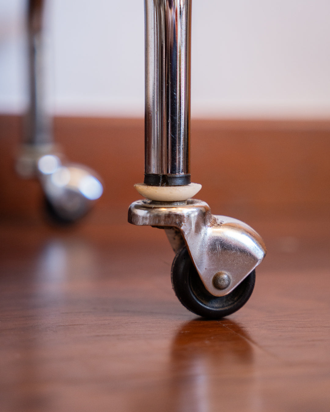Chrome side table with acrylic and smoked glass shelves, 1970s vintage.