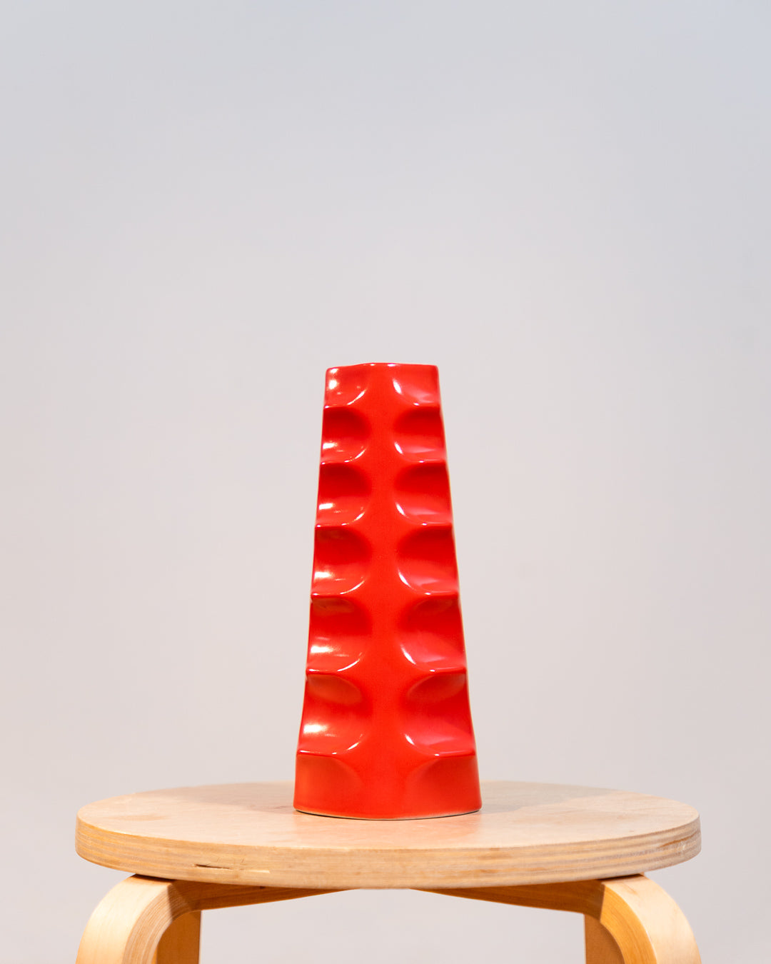 Vintage Molina Badalona ceramic flower vase from the 1970s in matte bright red glaze with wavy textured surface. Vecino Shop