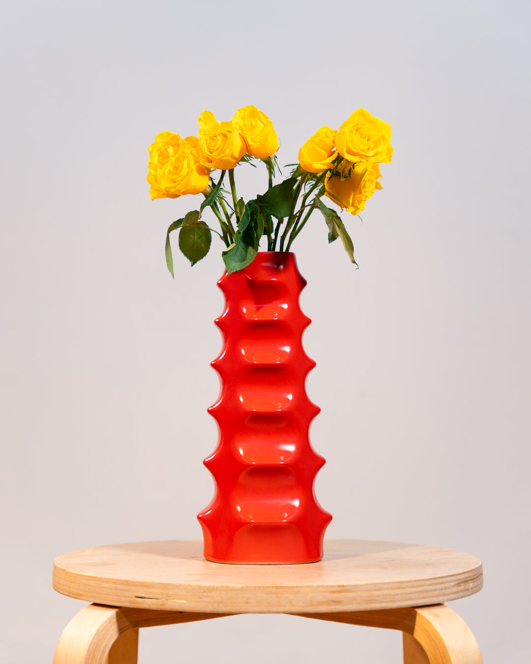 Vintage Molina Badalona ceramic flower vase from the 1970s in matte bright red glaze with wavy textured surface. Vecino Shop