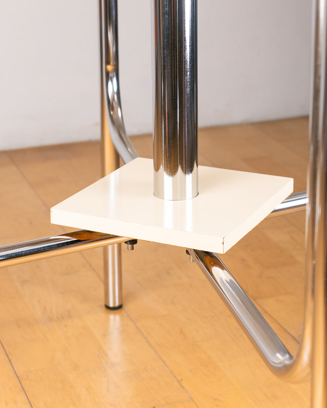 Vintage 1980s folding dining table with off white Formica table top, chrome tubular legs and rounded corners. Space Age space-saving design. Vecino Shop 