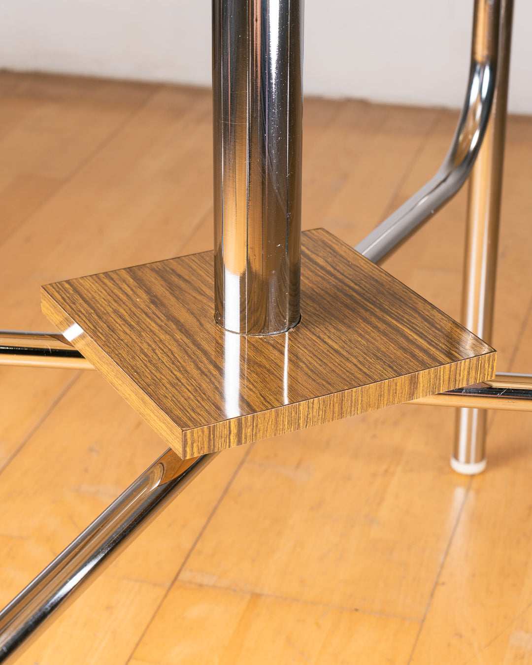 Vintage 1980s folding dining table with brown wood veneer Formica table top, chrome tubular legs and square corners. Space Age space-saving design. Vecino Shop 