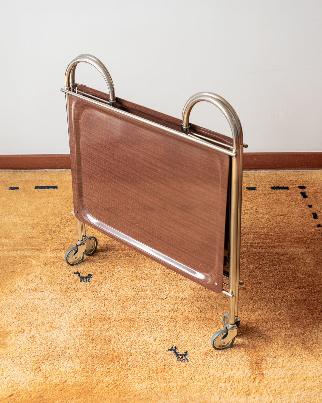 Vintage 1970s folding serving trolley with rare arched chrome frame and wood veneer shelves