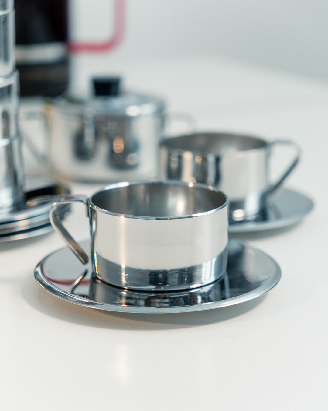 Vintage 1970s Italian double-walled stainless steel espresso set with six cups, saucers and matching sugar server. Vecino Shop