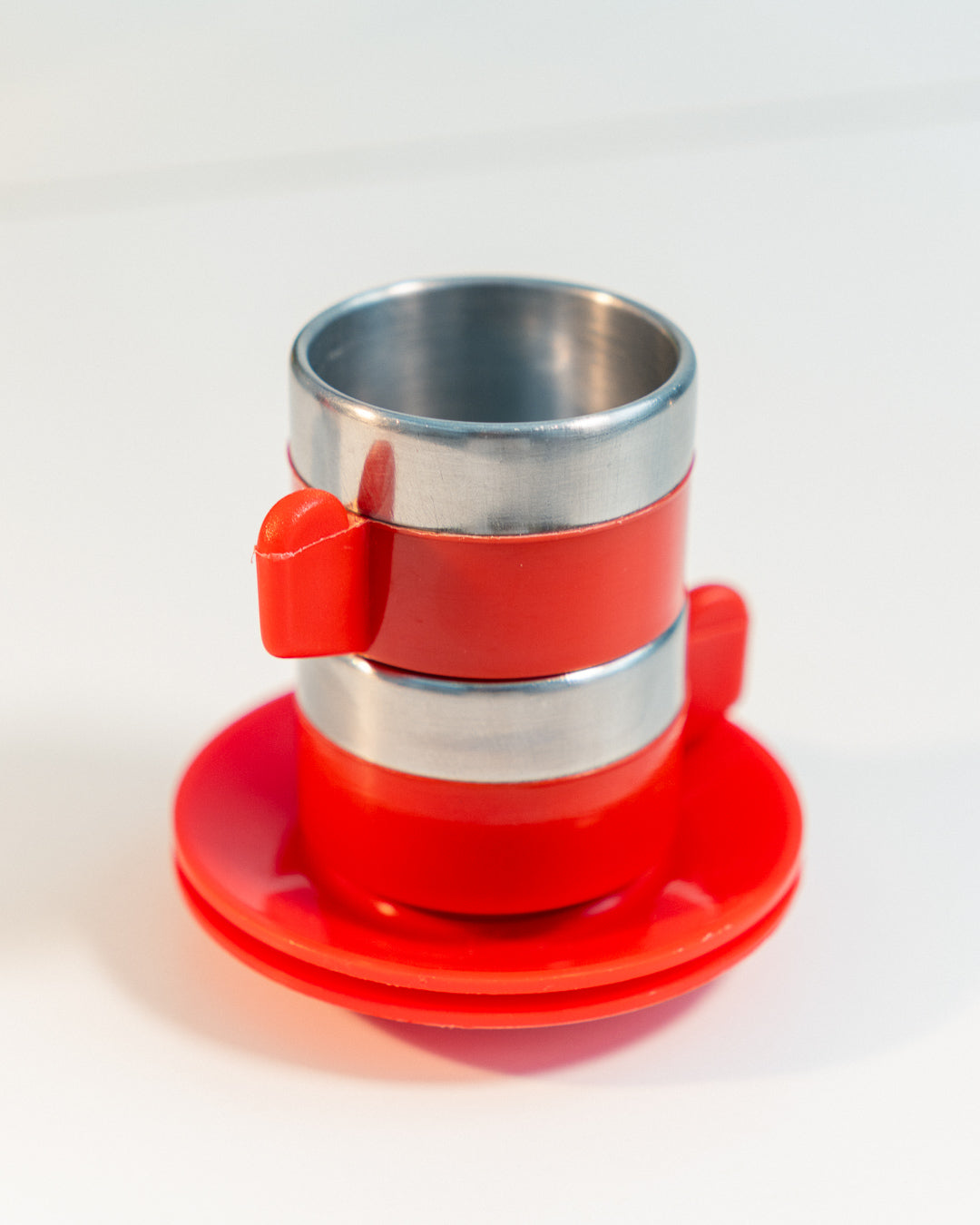 Vintage 1970s Jolly Rivadossi Italy double-walled stainless steel espresso cups with plastic red accent, saucers and sugar server. Vecino Shop