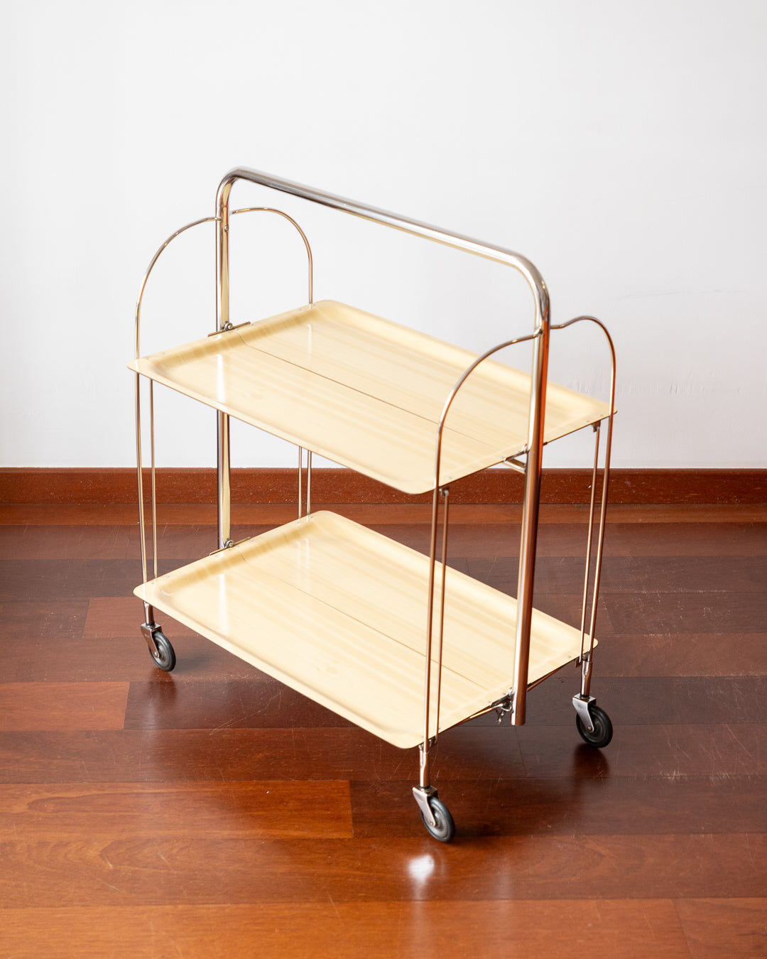 Vintage 1970s Raquer folding serving trolley with chrome frame and light wood veneer shelves