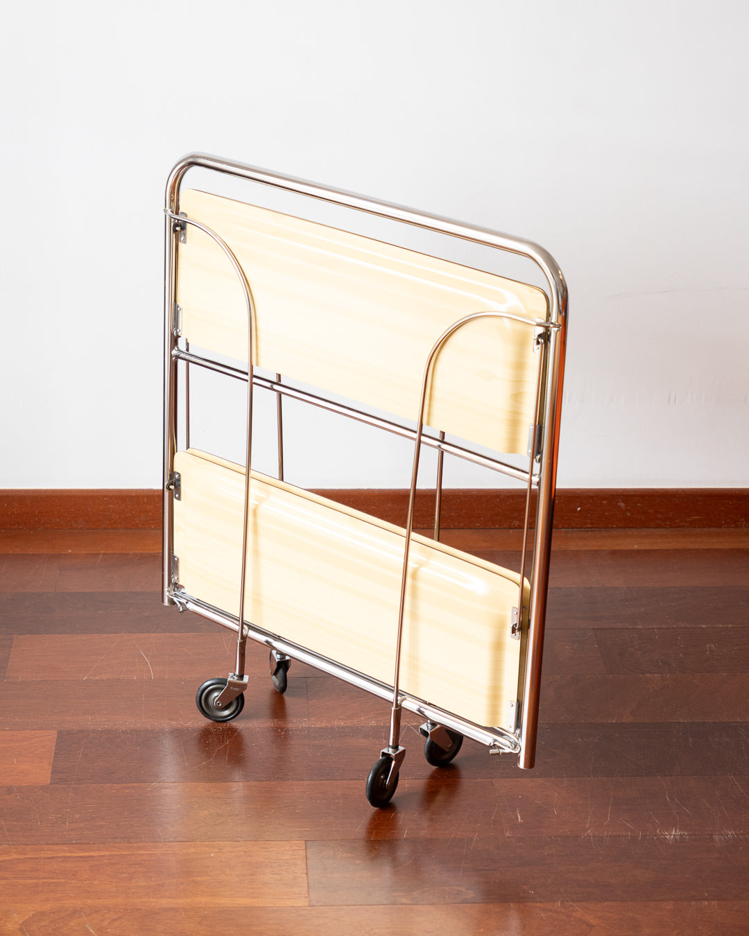 Vintage 1970s Raquer folding serving trolley with chrome frame and light wood veneer shelves