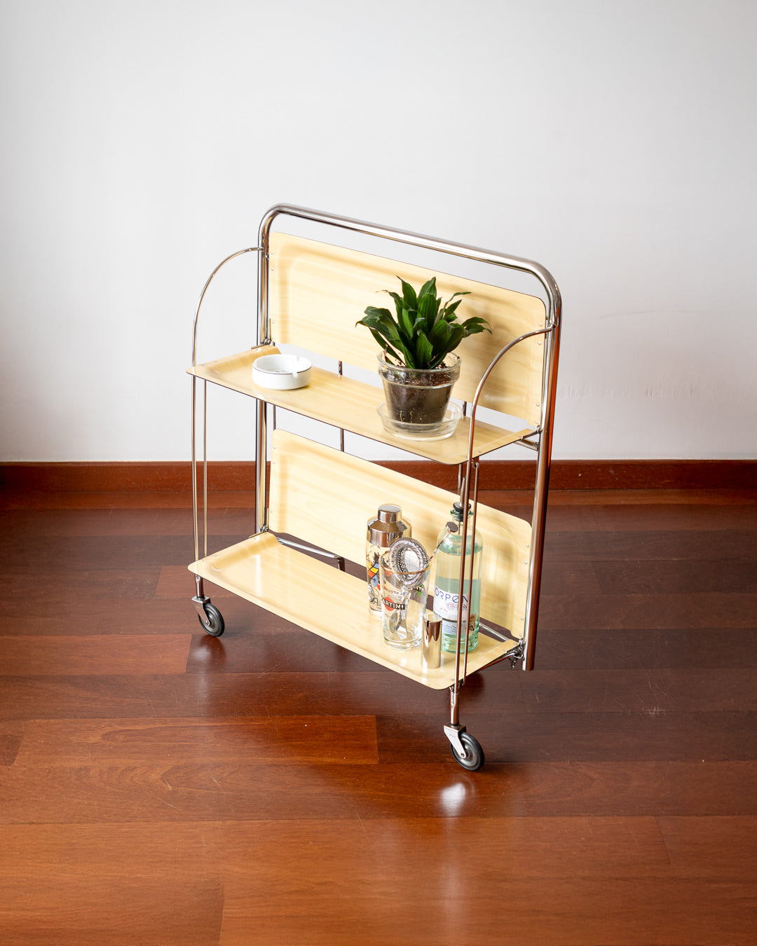 Vintage 1970s Raquer folding serving trolley with chrome frame and light wood veneer shelves