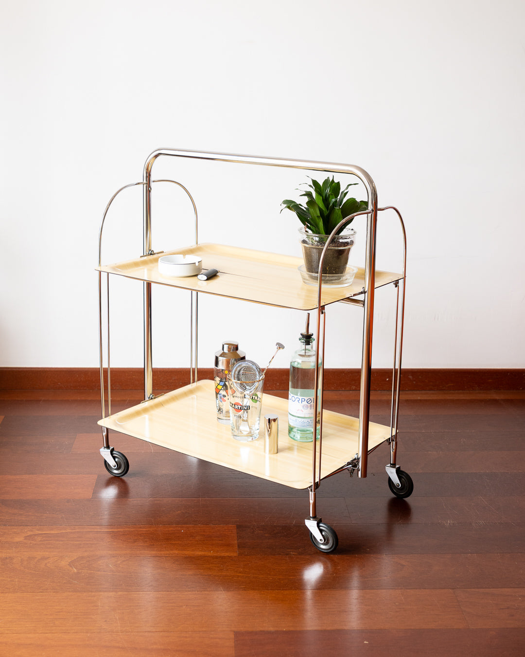 Vintage 1970s Raquer folding serving trolley with chrome frame and light wood veneer shelves