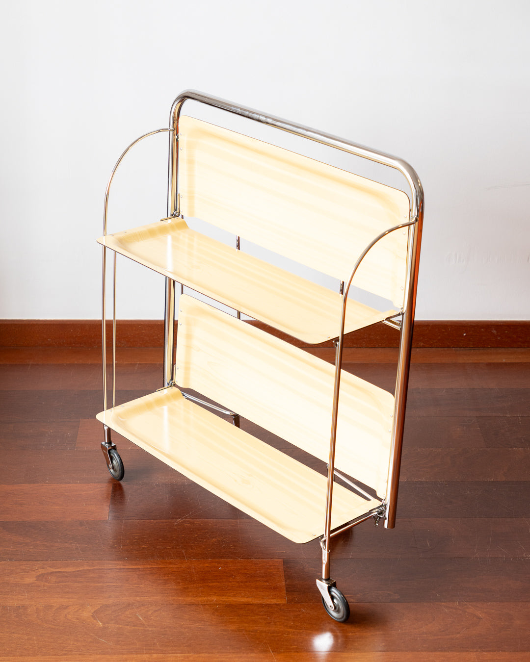 Vintage 1970s Raquer folding serving trolley with chrome frame and light wood veneer shelves