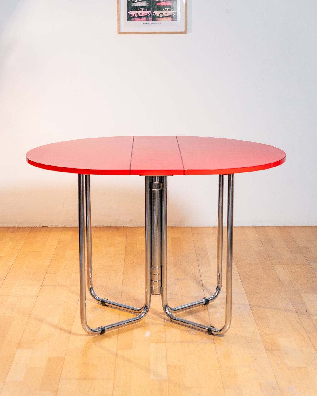 Vintage 1970s red Formica folding dining table with chrome frame and space-saving folding mechanism in Space Age style. Vecino Shop