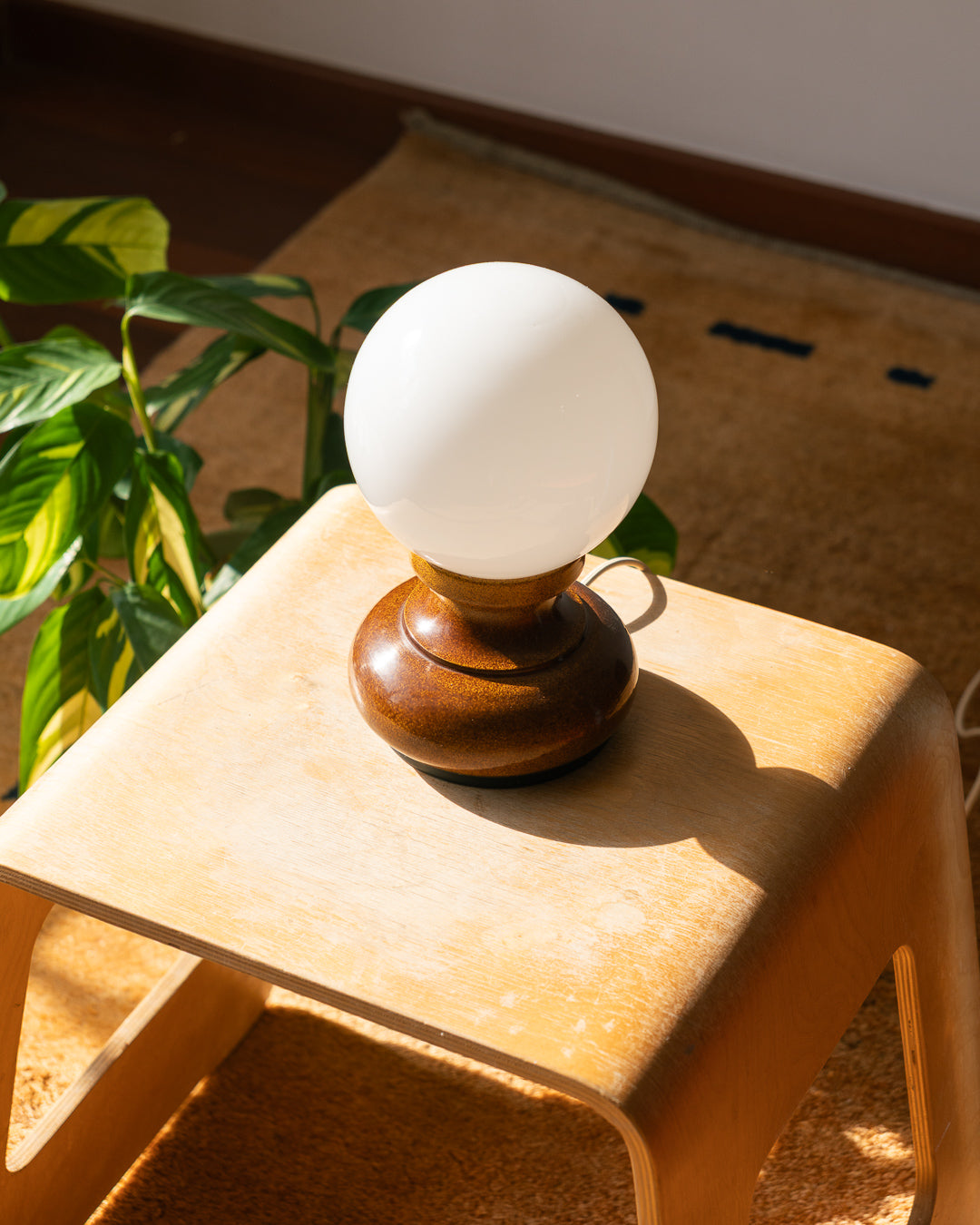 Vintage 1970s Space Age table lamp with speckled brown metal base and white opaline glass shade – Vecino Shop