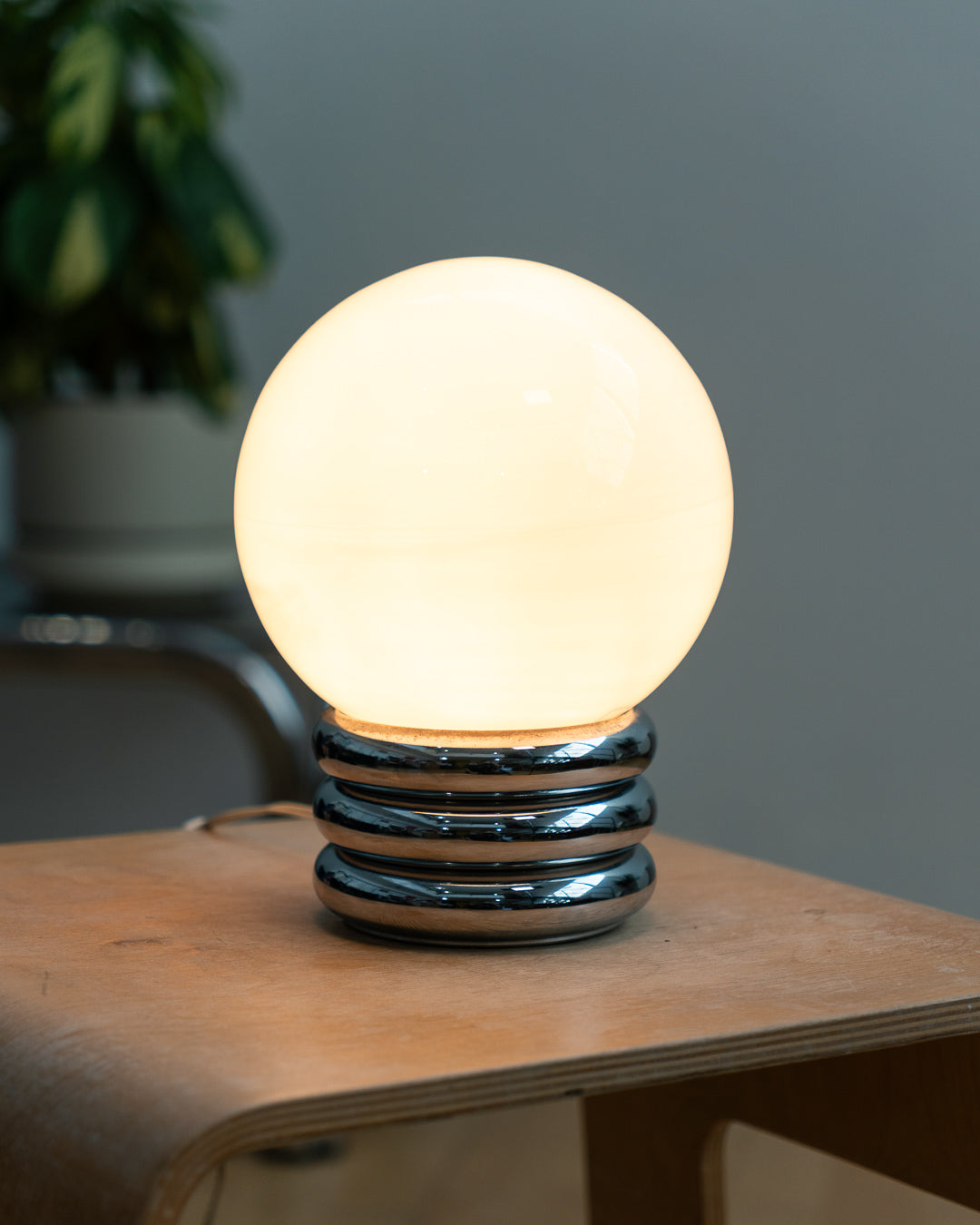 Vintage 1970s opaline orb table lamp with 3-banded chrome base, Space Age design. Two variants shown, Vecino Shop