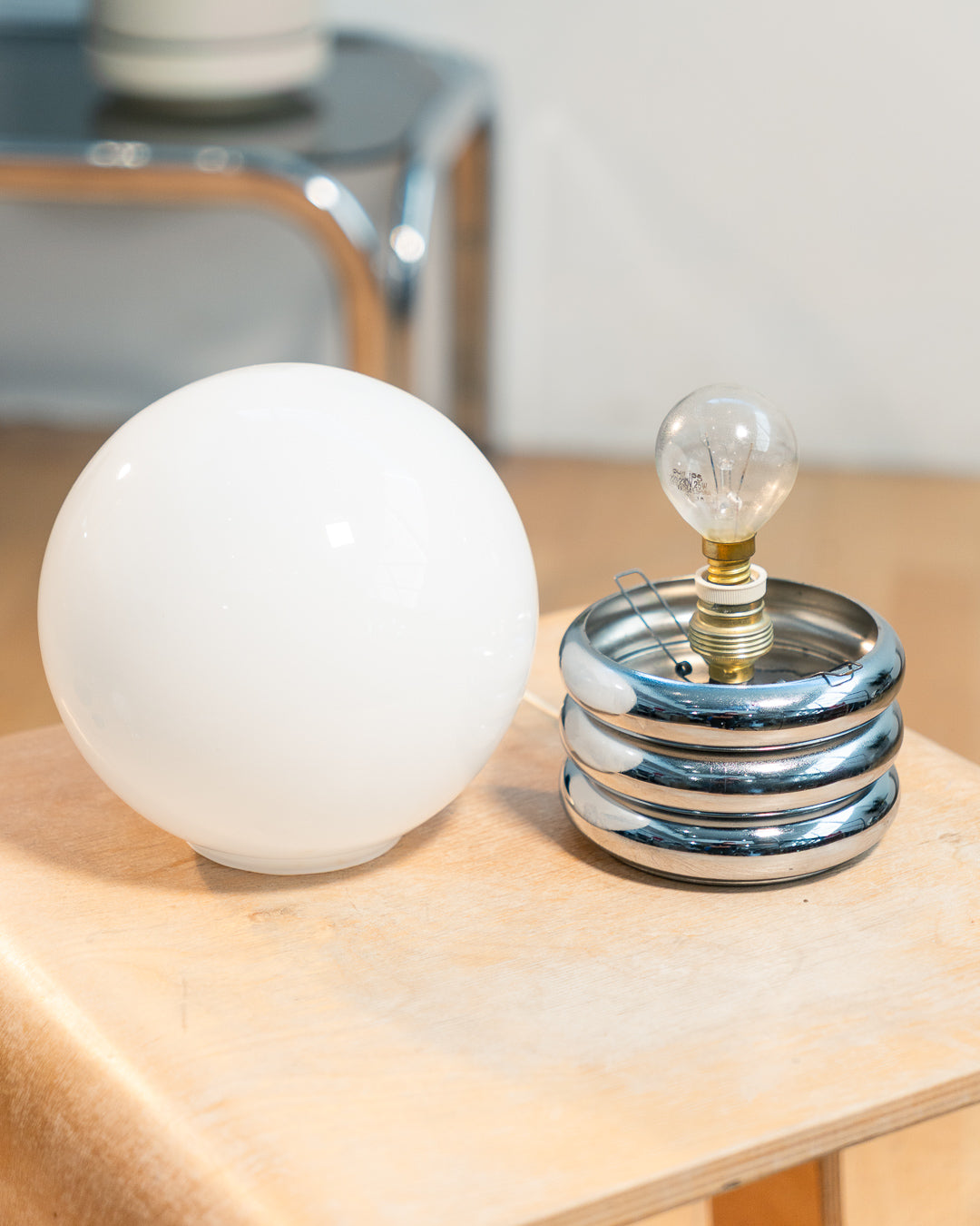 Vintage 1970s opaline orb table lamp with 3-banded chrome base, Space Age design. Two variants shown, Vecino Shop