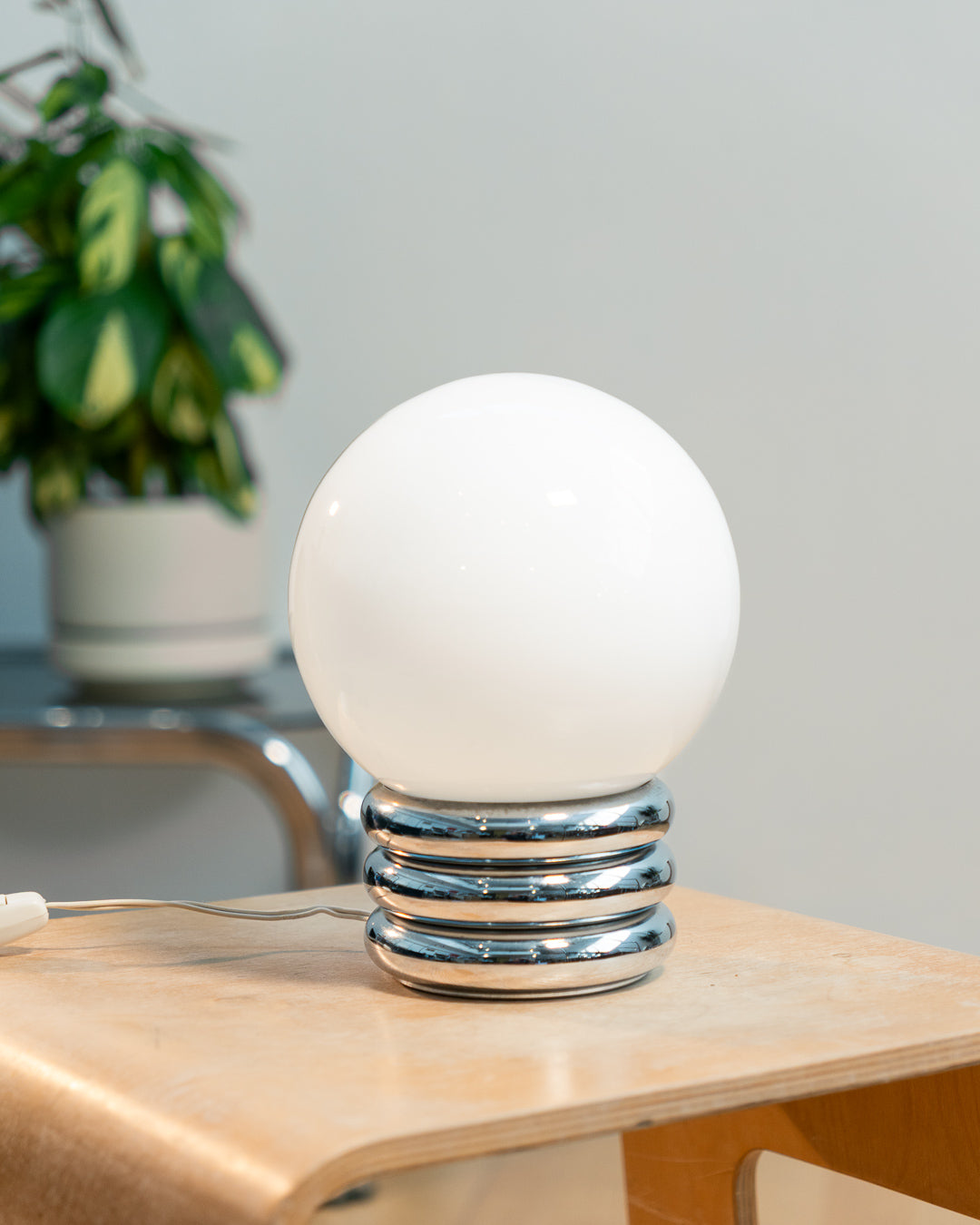 Vintage 1970s opaline orb table lamp with 3-banded chrome base, Space Age design. Two variants shown, Vecino Shop