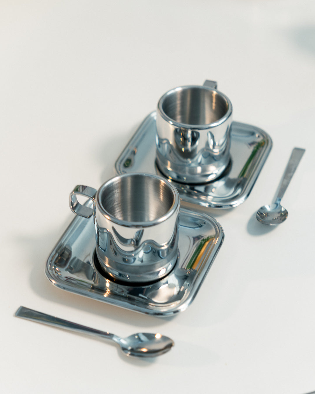 1980s Vintage Zini Italy double-walled stainless steel espresso set with cups, saucers, spoons and sugar server. Vecino Shop